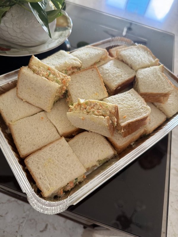 Chicken Mayo Sandwich: multiple sandwiches wrapped in white and red printed food-grade paper printed with food illustrations and the words "Fresh & Tasty," arranged in a tray.